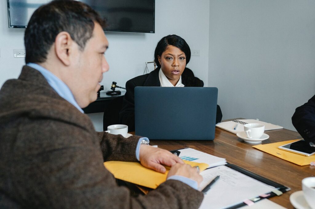 Overwhelmed woman at work in need of some anxiety coping skills for adults.