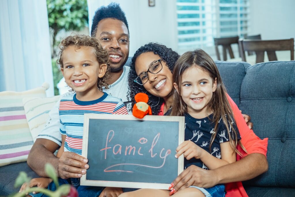 Smiling family enjoying the benefits of calm parenting.