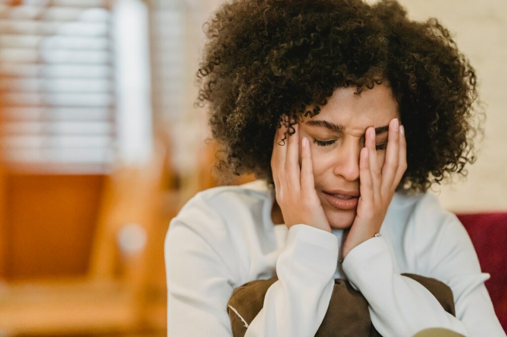 Upset ethnic woman dealing with self-criticism and anxiety.