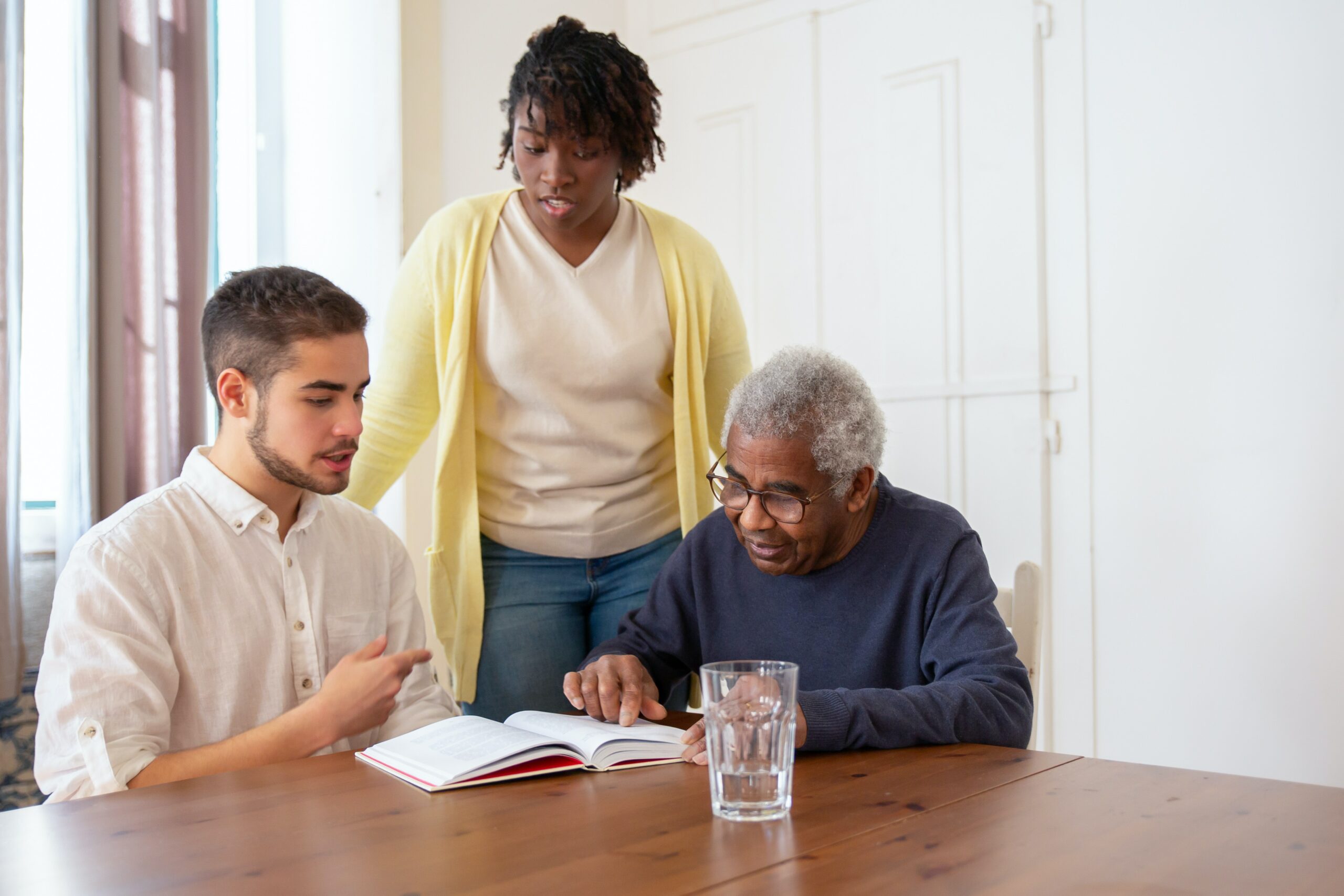 Woman standing beside her son and elderly father asking herself, “Why do I feel overwhelmed being my parents caretaker?” 